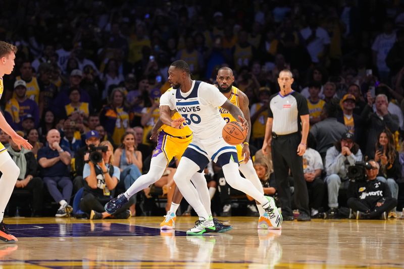 LOS ANGELES, CA - OCTOBER 22: Julius Randle #30 of the Minnesota Timberwolves dribbles the ball during the game against the Los Angeles Lakers on October 22, 2024 at Crypto.Com Arena in Los Angeles, California. NOTE TO USER: User expressly acknowledges and agrees that, by downloading and/or using this Photograph, user is consenting to the terms and conditions of the Getty Images License Agreement. Mandatory Copyright Notice: Copyright 2024 NBAE (Photo by Garrett Ellwood/NBAE via Getty Images)