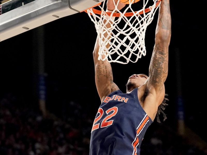 Mar 18, 2023; Birmingham, AL, USA; Auburn Tigers guard Allen Flanigan (22) dunks during the first half against the Houston Cougars at Legacy Arena. Mandatory Credit: Marvin Gentry-USA TODAY Sports