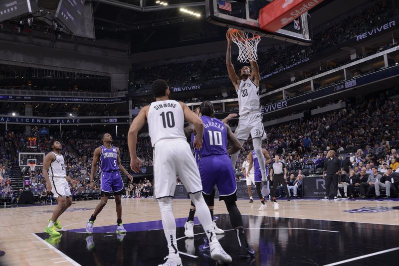 SACRAMENTO, CA - NOVEMBER 24: Nicolas Claxton #33 of the Brooklyn Nets dunks the ball during the game against the Sacramento Kings on November 24, 2024 at Golden 1 Center in Sacramento, California. NOTE TO USER: User expressly acknowledges and agrees that, by downloading and or using this Photograph, user is consenting to the terms and conditions of the Getty Images License Agreement. Mandatory Copyright Notice: Copyright 2024 NBAE (Photo by Rocky Widner/NBAE via Getty Images)