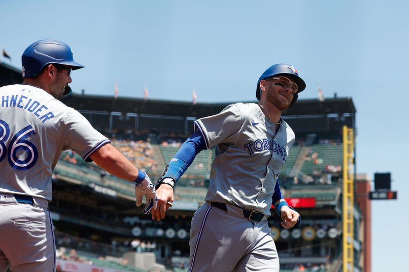Jul 11, 2024; San Francisco, California, USA; Toronto Blue Jays catcher Danny Jansen (9) hits a one run home run during the first inning against the San Francisco Giants at Oracle Park. Mandatory Credit: Sergio Estrada-USA TODAY Sports