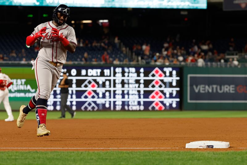 Sep 10, 2024; Washington, District of Columbia, USA; Atlanta Braves outfielder Michael Harris II (23) gestures towards his dugout while rounding third base after hitting a solo home run against the Washington Nationals during the ninth inning at Nationals Park. Mandatory Credit: Geoff Burke-Imagn Images