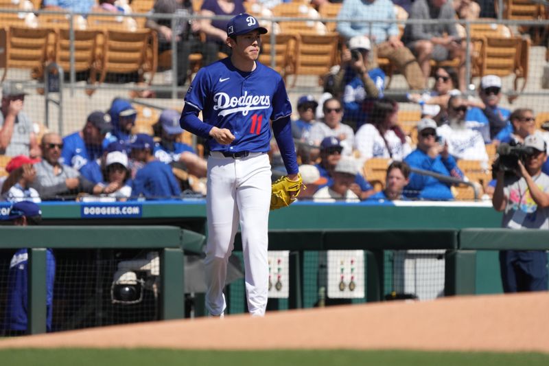 Mar 11, 2025; Phoenix, Arizona, USA; Los Angeles Dodgers pitcher Roki Susaki (11) gets ready for a game against the Cleveland Guardians at Camelback Ranch-Glendale. Mandatory Credit: Rick Scuteri-Imagn Images