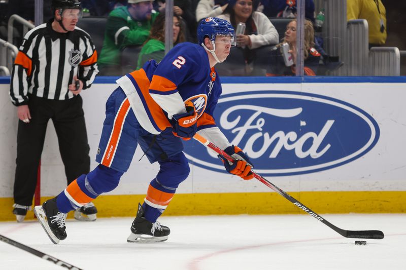 Mar 16, 2024; Elmont, New York, USA;  New York Islanders defenseman Mike Reilly (2) skates with the puck against Ottawa Senators during the third period at UBS Arena. Mandatory Credit: Thomas Salus-USA TODAY Sports