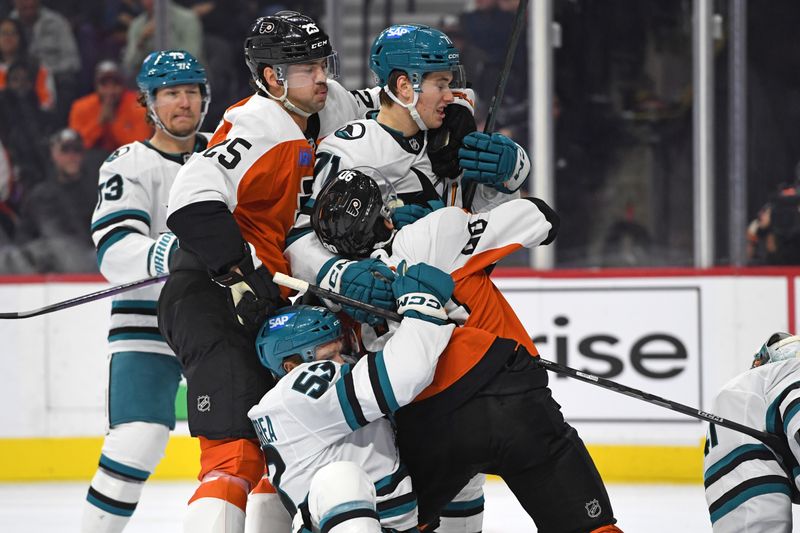 Nov 11, 2024; Philadelphia, Pennsylvania, USA; Philadelphia Flyers defenseman Rasmus Ristolainen (55) and center Anthony Richard (90) battle with San Jose Sharks center Ty Dellandrea (53) and center Macklin Celebrini (71) during the third period at Wells Fargo Center. Mandatory Credit: Eric Hartline-Imagn Images