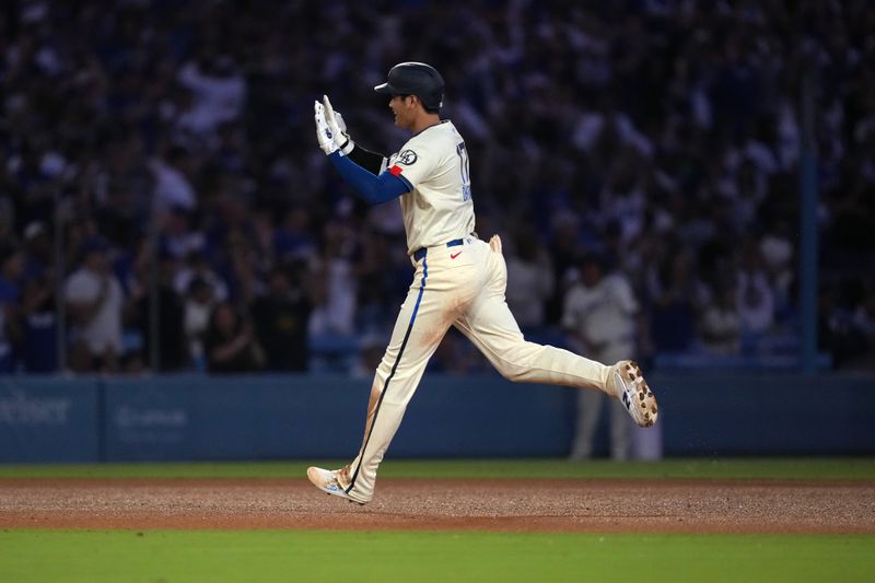 Aug 24, 2024; Los Angeles, California, USA; Los Angeles Dodgers designated hitter Shohei Ohtani (17) runs the bases after hitting a two-run home run in the fifth inning against the Tampa Bay Rays at Dodger Stadium. Mandatory Credit: Kirby Lee-USA TODAY Sports