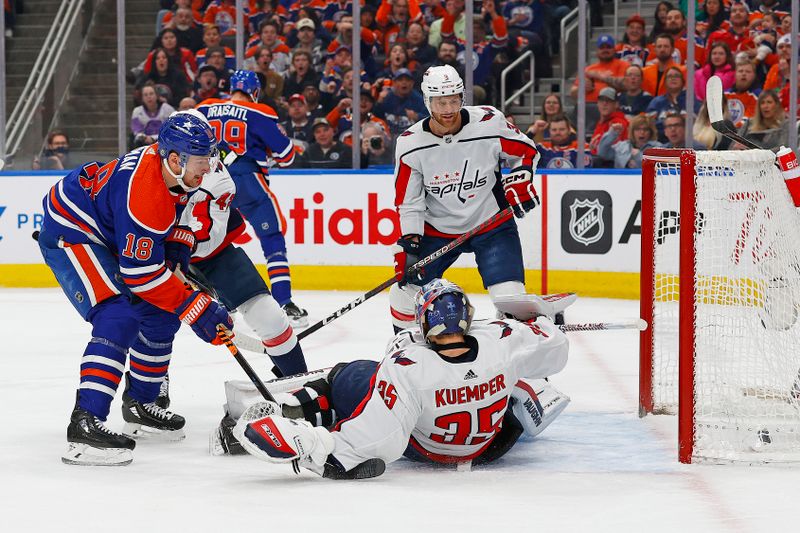 Mar 13, 2024; Edmonton, Alberta, CAN; Edmonton Oilers forward Zach Hyman (18) scores a goal during the first period against Washington Capitals goaltender Darcy Kuemper (35) at Rogers Place. Mandatory Credit: Perry Nelson-USA TODAY Sports