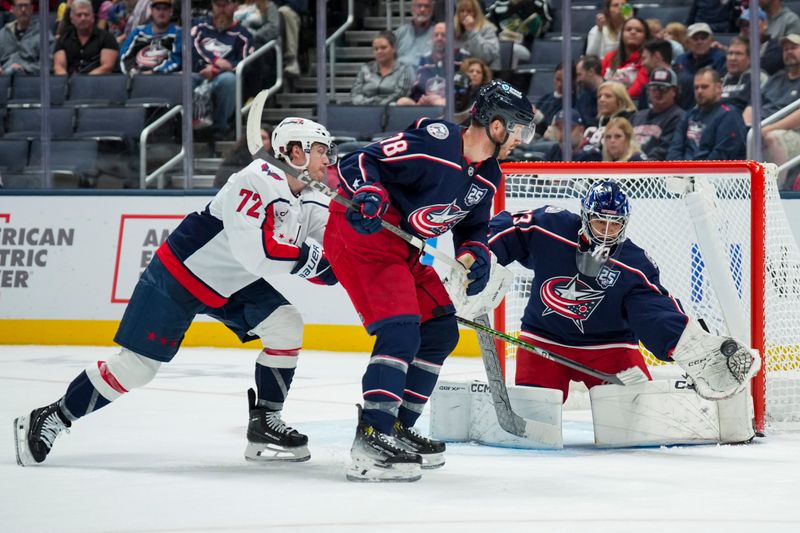 Sep 30, 2025; Columbus, Ohio, USA; Columbus Blue Jackets goaltender Jet Greaves (73) makes a save in net as Washington Capitals left wing Anthony Beauvillier (72) skates against Columbus Blue Jackets defenseman Damon Severson (78) in the second period at Nationwide Arena. Mandatory Credit: Aaron Doster-Imagn Images