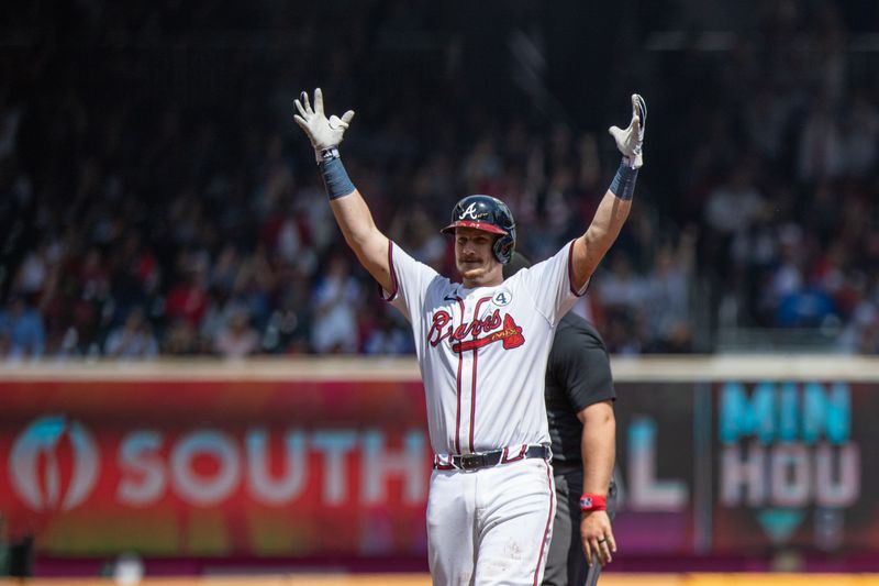 Jun 2, 2024; Cumberland, Georgia, USA;   Atlanta Braves catcher Sean Murphy (12) celebrates hitting a double against the Oakland Athletics during the seventh inning at Truist Park. Mandatory Credit: Jordan Godfree-USA TODAY Sports