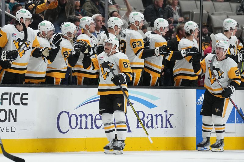 Nov 4, 2023; San Jose, California, USA; Pittsburgh Penguins left wing Matt Nieto (83) is congratulated by teammates after scoring a goal against the San Jose Sharks during the second period at SAP Center at San Jose. Mandatory Credit: Darren Yamashita-USA TODAY Sports