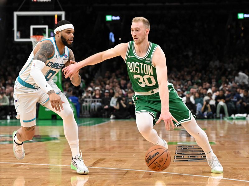 BOSTON, MASSACHUSETTS - APRIL 12: Sam Hauser #30 of the Boston Celtics dribbles the ball against Miles Bridges #0 of the Charlotte Hornets during the second quarter at the TD Garden on April 12, 2024 in Boston, Massachusetts. NOTE TO USER: User expressly acknowledges and agrees that, by downloading and or using this photograph, User is consenting to the terms and conditions of the Getty Images License Agreement. (Photo by Brian Fluharty/Getty Images)