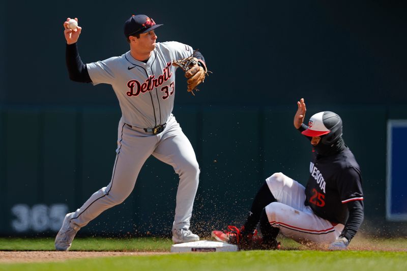 Apr 20, 2024; Minneapolis, Minnesota, USA; Detroit Tigers second baseman Colt Keith (33) forces out Minnesota Twins center fielder Byron Buxton (25) and turns a double play in the fourth inning at Target Field. Mandatory Credit: Bruce Kluckhohn-USA TODAY Sports