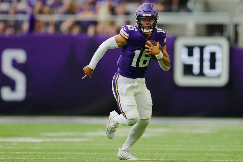 Minnesota Vikings quarterback Jaren Hall carries the ball during the first half of an NFL preseason football game against the Arizona Cardinals, Saturday, Aug. 26, 2023, in Minneapolis. (AP Photo/Abbie Parr)