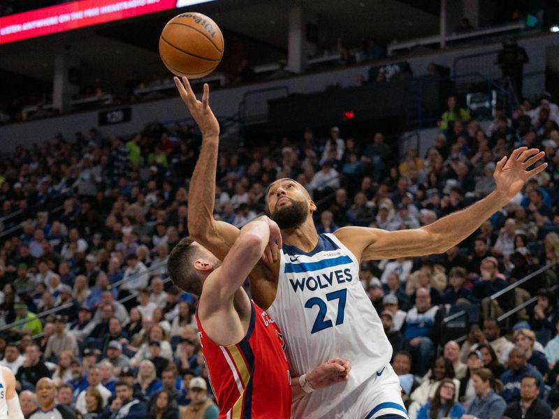 MINNEAPOLIS, MINNESOTA - MARCH 19: Rudy Gobert #27 of the Minnesota Timberwolves is fouled on the way to the basket during a shot at Target Center on March 19, 2025 in Minneapolis, Minnesota. NOTE TO USER: User expressly acknowledges and agrees that, by downloading and or using this photograph, User is consenting to the terms and conditions of the Getty Images License Agreement. (Photo by Ben Brewer/Getty Images)