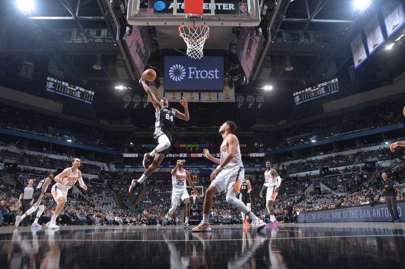 SAN ANTONIO, TX - DECEMBER 4: Devin Vassell #24 of the San Antonio Spurs drives to the basket during the game against the Phoenix Suns on December 4, 2022 at the AT&T Center in San Antonio, Texas. NOTE TO USER: User expressly acknowledges and agrees that, by downloading and or using this photograph, user is consenting to the terms and conditions of the Getty Images License Agreement. Mandatory Copyright Notice: Copyright 2022 NBAE (Photos by Michael Gonzales/NBAE via Getty Images)