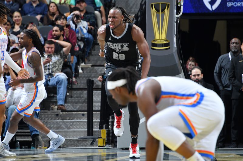 SAN ANTONIO, TX - NOVEMBER 19: Charles Bassey #28 of the San Antonio Spurs celebrates during the game against the Oklahoma City Thunder during the Emirates NBA Cup game on November 19, 2024 at the Frost Bank Center in San Antonio, Texas. NOTE TO USER: User expressly acknowledges and agrees that, by downloading and or using this photograph, user is consenting to the terms and conditions of the Getty Images License Agreement. Mandatory Copyright Notice: Copyright 2024 NBAE (Photos by Michael Gonzales/NBAE via Getty Images)