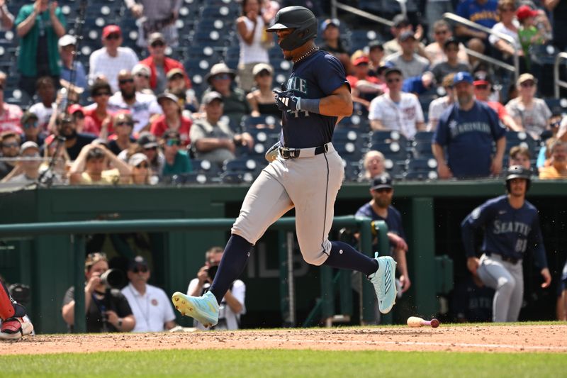 May 26, 2024; Washington, District of Columbia, USA; Seattle Mariners center fielder Julio Rodriguez (44) crosses home plate for a run against the Washington Nationals during the eighth inning at Nationals Park. Mandatory Credit: Rafael Suanes-USA TODAY Sports