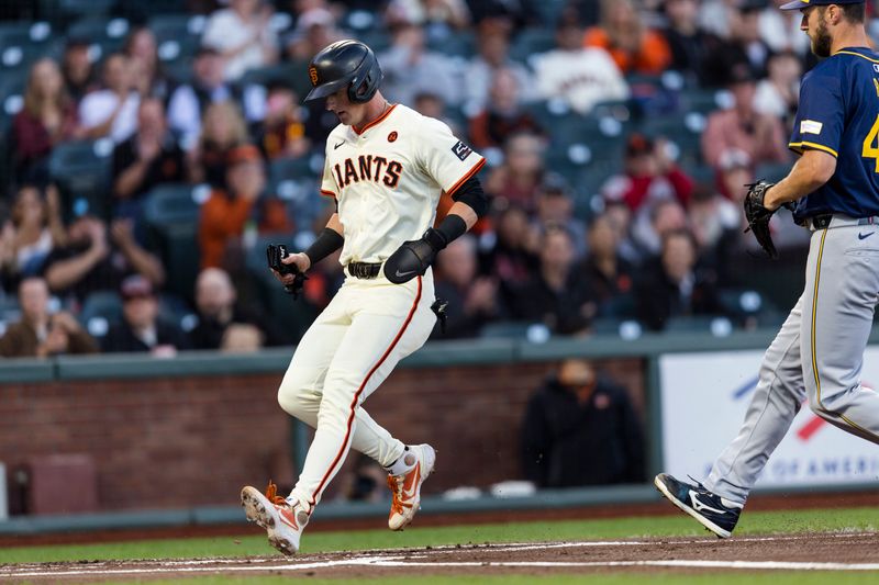 Sep 11, 2024; San Francisco, California, USA; San Francisco Giants shortstop Tyler Fitzgerald (49) scores on a wild pitch by Milwaukee Brewers starting pitcher Colin Rea (48) during the first inning at Oracle Park. Mandatory Credit: John Hefti-Imagn Images