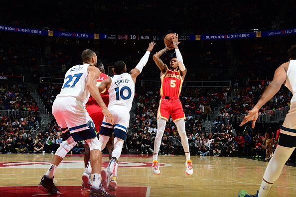 ATLANTA, GA - OCTOBER 30: Dejounte Murray #5 of the Atlanta Hawks shoots a three point basket against the Minnesota Timberwolves on October 30, 2023 at State Farm Arena in Atlanta, Georgia.  NOTE TO USER: User expressly acknowledges and agrees that, by downloading and/or using this Photograph, user is consenting to the terms and conditions of the Getty Images License Agreement. Mandatory Copyright Notice: Copyright 2023 NBAE (Photo by Scott Cunningham/NBAE via Getty Images)