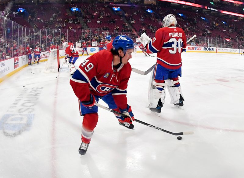 Mar 14, 2024; Montreal, Quebec, CAN; Montreal Canadiens forward Rafael Harvey-Pinard (49) skates during the warmup period before the game against the Boston Bruins at the Bell Centre. Mandatory Credit: Eric Bolte-USA TODAY Sports