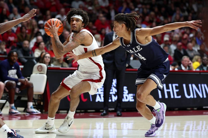 Dec 29, 2025; Tuscaloosa, Alabama, USA; Alabama Crimson Tide forward Amari Allen (5) dribbles against Yale Bulldogs guard Casey Simmons (14) during the first half at Coleman Coliseum. Mandatory Credit: David Leong-Imagn Images