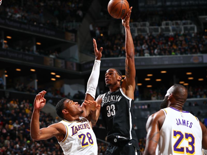 BROOKLYN, NY - MARCH 31: Nicolas Claxton #33 of the Brooklyn Nets goes to the basket during the game on March 31, 2024 at Barclays Center in Brooklyn, New York. NOTE TO USER: User expressly acknowledges and agrees that, by downloading and or using this Photograph, user is consenting to the terms and conditions of the Getty Images License Agreement. Mandatory Copyright Notice: Copyright 2024 NBAE (Photo by David L. Nemec/NBAE via Getty Images)