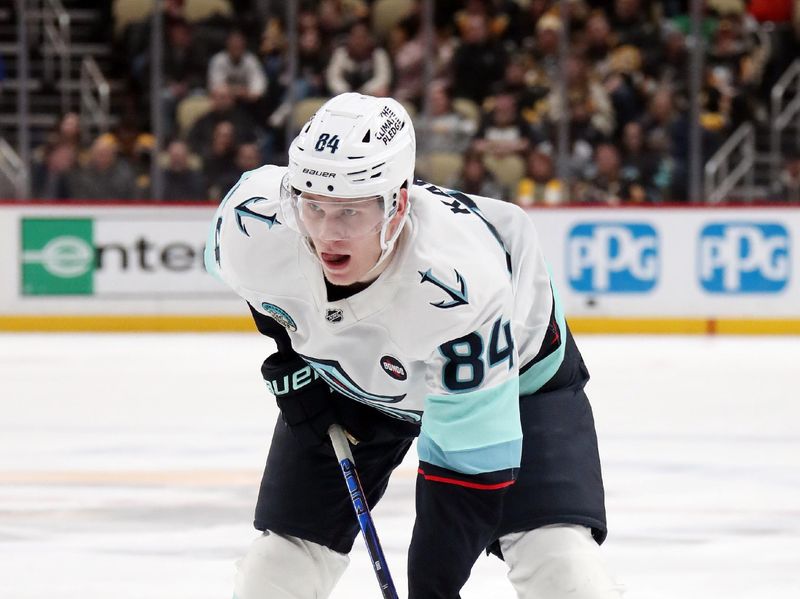 Jan 14, 2025; Pittsburgh, Pennsylvania, USA;  Seattle Kraken right wing Kaapo Kakko (84) at the face-off circle against the Pittsburgh Penguins during the second period at PPG Paints Arena. Mandatory Credit: Charles LeClaire-Imagn Images