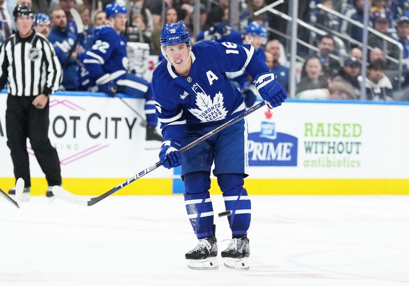 Oct 12, 2024; Toronto, Ontario, CAN; Toronto Maple Leafs right wing Mitch Marner (16) follows the play during the third period against the Pittsburgh Penguins at Scotiabank Arena. Mandatory Credit: Nick Turchiaro-Imagn Images