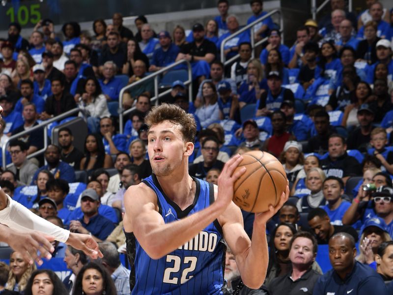 ORLANDO, FL - APRIL 27: Franz Wagner #22 of the Orlando Magic passes the ball during the game against the Cleveland Cavaliers during Round 1 Game 4 of the 2024 NBA Playoffs on April 27, 2024 at the Kia Center in Orlando, Florida. NOTE TO USER: User expressly acknowledges and agrees that, by downloading and or using this photograph, User is consenting to the terms and conditions of the Getty Images License Agreement. Mandatory Copyright Notice: Copyright 2024 NBAE (Photo by Fernando Medina/NBAE via Getty Images)