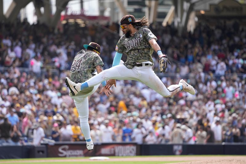 Jun 18, 2023; San Diego, California, USA;  San Diego Padres right fielder Fernando Tatis Jr. (23) celebrates with second baseman Rougned Odor (24) after defeating the Tampa Bay Rays at Petco Park. Mandatory Credit: Ray Acevedo-USA TODAY Sports