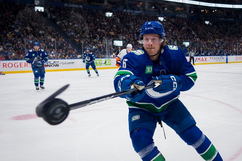 Nov 15, 2023; Vancouver, British Columbia, CAN; Vancouver Canucks forward Brock Boeser (6) knocks down a flying puck in the second period at Rogers Arena. Mandatory Credit: Bob Frid-USA TODAY Sports