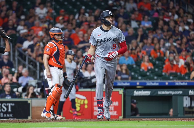 May 31, 2024; Houston, Texas, USA; Minnesota Twins designated hitter Trevor Larnach (9) hits a home run during the fifth inning against the Houston Astros at Minute Maid Park. Mandatory Credit: Troy Taormina-USA TODAY Sports