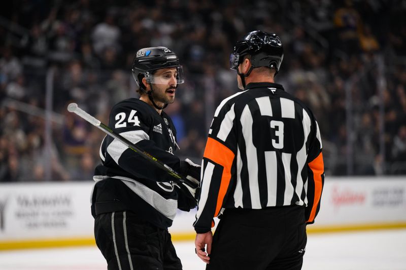 Oct 18, 2025; Los Angeles, California, USA; Los Angeles Kings center Phillip Danault (24) pleads his case after a goalie interference call was made taking away a goal by left wing Trevor Moore (12) during the second period against the Carolina Hurricanes at Crypto.com Arena. Mandatory Credit: William Liang-Imagn Images