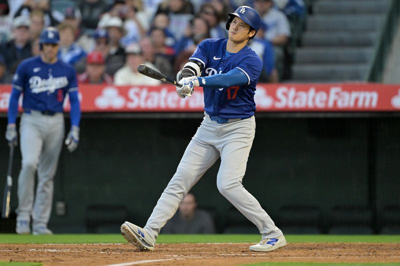 Mar 26, 2024; Anaheim, California, USA; Los Angeles Dodgers designated hitter Shohei Ohtani (17) strikes out in the third inning against the Los Angeles Angels at Angel Stadium. Mandatory Credit: Jayne Kamin-Oncea-USA TODAY Sports