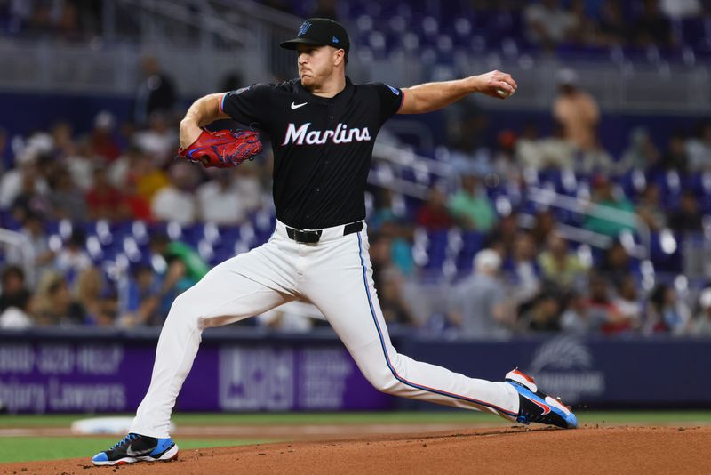 Jun 21, 2024; Miami, Florida, USA; Miami Marlins starting pitcher Trevor Rogers (28) delivers a pitch against the Seattle Mariners during the first inning at loanDepot Park. Mandatory Credit: Sam Navarro-USA TODAY Sports