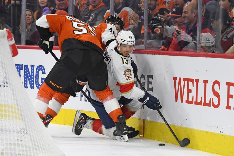 Dec 5, 2024; Philadelphia, Pennsylvania, USA; Florida Panthers center Sam Reinhart (13) battle for the puck with Philadelphia Flyers defenseman Rasmus Ristolainen (55) and center Morgan Frost (48) during the second period at Wells Fargo Center. Mandatory Credit: Eric Hartline-Imagn Images