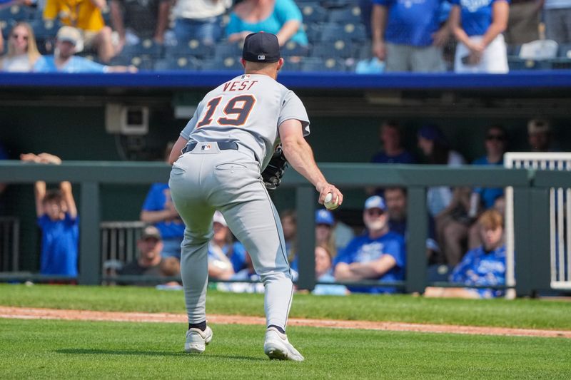 Jun 1, 2025; Kansas City, Missouri, USA; Detroit Tigers relief pitcher Will Vest (19) fields an in field hit and throws to first base for an out against the Kansas City Royals in the ninth inning at Kauffman Stadium. Mandatory Credit: Denny Medley-Imagn Images