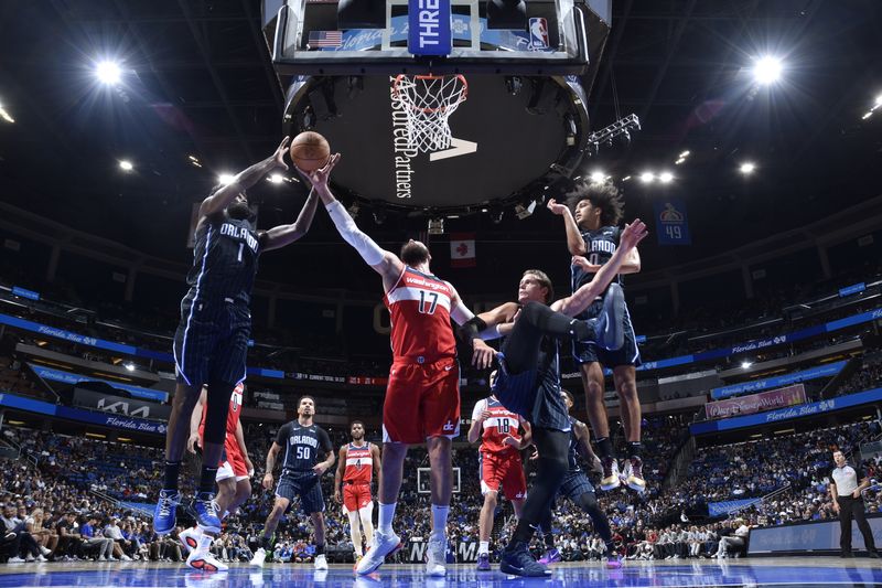 ORLANDO, FL - NOVMEBER 10: Jonas Valanciunas #17 of the Washington Wizards goes up for the rebound during the game against the Orlando Magic on November 10, 2024 at Kia Center in Orlando, Florida. NOTE TO USER: User expressly acknowledges and agrees that, by downloading and or using this photograph, User is consenting to the terms and conditions of the Getty Images License Agreement. Mandatory Copyright Notice: Copyright 2024 NBAE (Photo by Fernando Medina/NBAE via Getty Images)