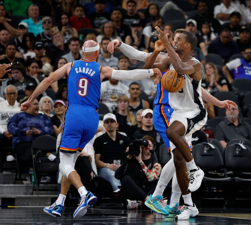 SAN ANTONIO, TX - OCTOBER 07: Alex Caruso #9 of the Oklahoma City Thunder strips the ball from Harrison Barnes #40 of the San Antonio Spurs in the first half of a preseason game at Frost Bank Center on October 7, 2024 in San Antonio, Texas. NOTE TO USER: User expressly acknowledges and agrees that, by downloading and or using this photograph, User is consenting to terms and conditions of the Getty Images License Agreement. (Photo by Ronald Cortes/Getty Images)