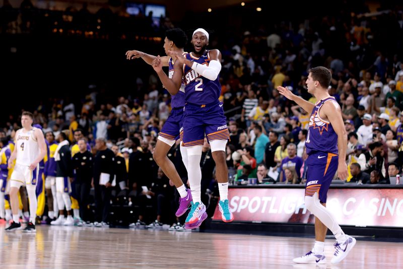 PALM SPRINGS, CALIFORNIA - OCTOBER 06: Ryan Dunn #0, Josh Okogie #2 and Collin Gillespie #12 of the Phoenix Suns celebrate after a 118-114 win against the Los Angeles Lakers at Acrisure Arena on October 06, 2024 in Palm Springs, California. NOTE TO USER: User expressly acknowledges and agrees that, by downloading and/or using this photograph, user is consenting to the terms and conditions of the Getty Images License Agreement. (Photo by Katelyn Mulcahy/Getty Images)