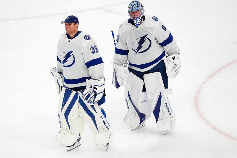 Mar 19, 2024; Las Vegas, Nevada, USA; Tampa Bay Lightning goaltender Jonas Johansson (31) and Tampa Bay Lightning goaltender Andrei Vasilevskiy (88) leave the ice after the Lightning defeated the Vegas Golden Knights 5-3 at T-Mobile Arena. Mandatory Credit: Stephen R. Sylvanie-USA TODAY Sports