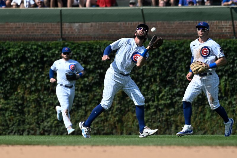 Aug 20, 2023; Chicago, Illinois, USA;  Chicago Cubs shortstop Dansby Swanson (7) catches a fly ball hit by Kansas City Royals catcher Salvador Perez (13) during the ninth inning at Wrigley Field. Mandatory Credit: Matt Marton-USA TODAY Sports