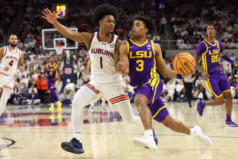 Jan 13, 2024; Auburn, Alabama, USA; Auburn Tigers guard Aden Holloway (1) pressures LSU Tigers guard Jalen Cook (3) during the first half at Neville Arena. Mandatory Credit: John Reed-USA TODAY Sports