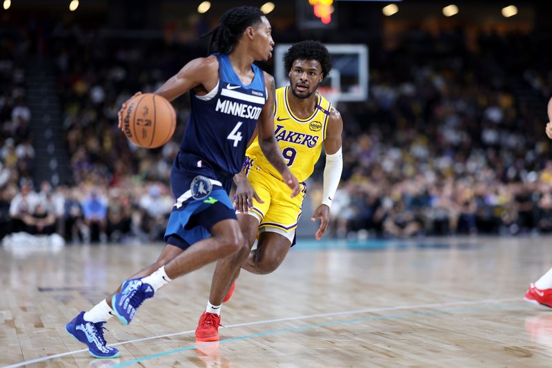 PALM SPRINGS, CALIFORNIA - OCTOBER 04: Bronny James #9 of the Los Angeles Lakers defends against Nickeil Alexander-Walker #9 of the Minnesota Timberwolves during the second half of a game at Acrisure Arena on October 04, 2024 in Palm Springs, California.  (Photo by Sean M. Haffey/Getty Images)