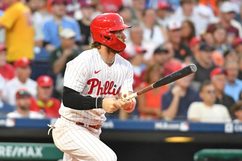 Jul 26, 2023; Philadelphia, Pennsylvania, USA;  Philadelphia Phillies designated hitter Bryce Harper (3) hits an RBI single against the Baltimore Orioles during the seventh inning at Citizens Bank Park. Mandatory Credit: Eric Hartline-USA TODAY Sports