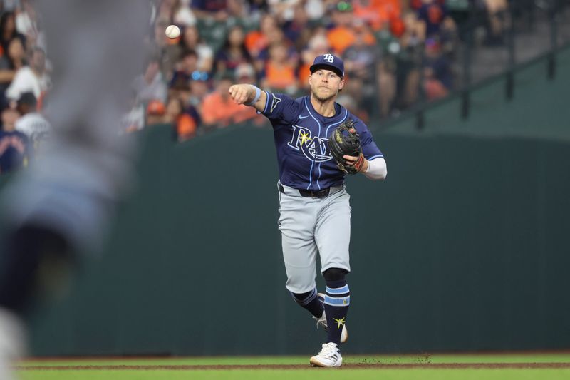 May 30, 2025; Houston, Texas, USA; Tampa Bay Rays shortstop Taylor Walls (6) throws to first base for an out during the sixth inning against the Houston Astros at Daikin Park. Mandatory Credit: Troy Taormina-Imagn Images