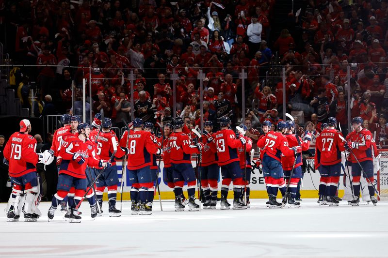 Apr 30, 2025; Washington, District of Columbia, USA; Washington Capitals players celebrate after the final horn against the Montreal Canadiens in game five of the first round of the 2025 Stanley Cup Playoffs at Capital One Arena. Mandatory Credit: Geoff Burke-Imagn Images