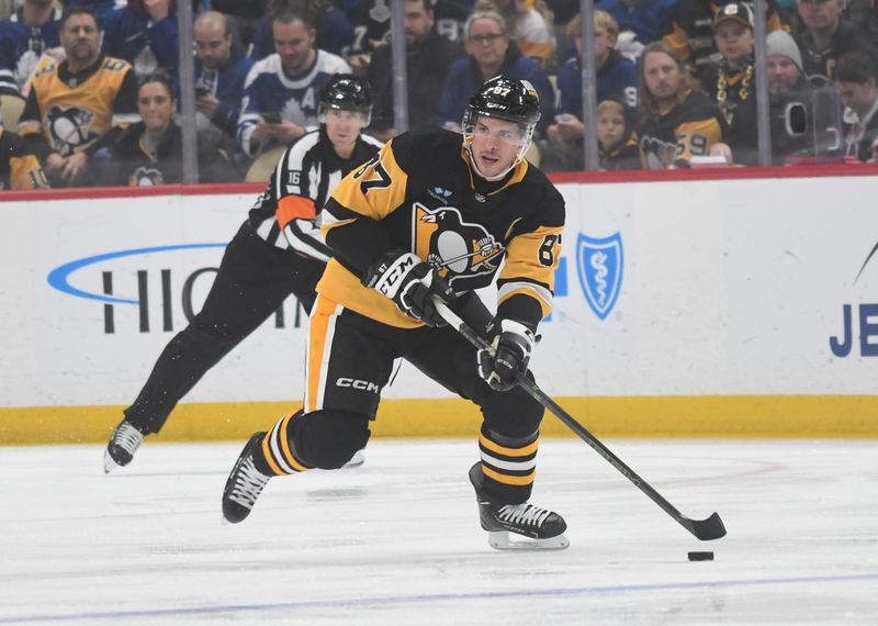 Nov 25, 2023; Pittsburgh, Pennsylvania, USA; Pittsburgh Penguins center Sidney Crosby (87) moves the puck against Toronto Maple Leafs during the first period at PPG Paints Arena. Mandatory Credit: Philip G. Pavely-USA TODAY Sports