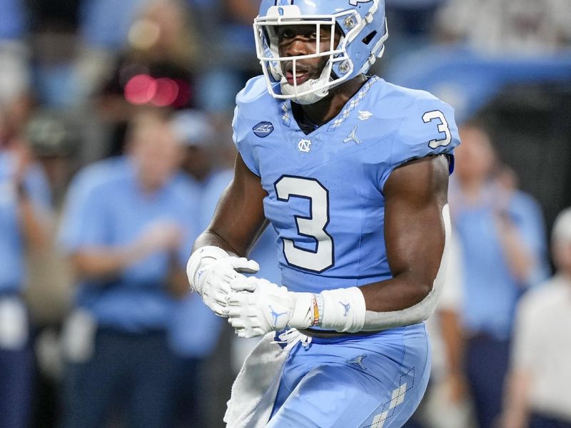 Sep 2, 2023; Charlotte, North Carolina, USA; North Carolina Tar Heels linebacker Amari Gainer (3) reacts to his sack on South Carolina Gamecocks quarterback Spencer Rattler (7) during the second half at Bank of America Stadium. Mandatory Credit: Jim Dedmon-USA TODAY Sports