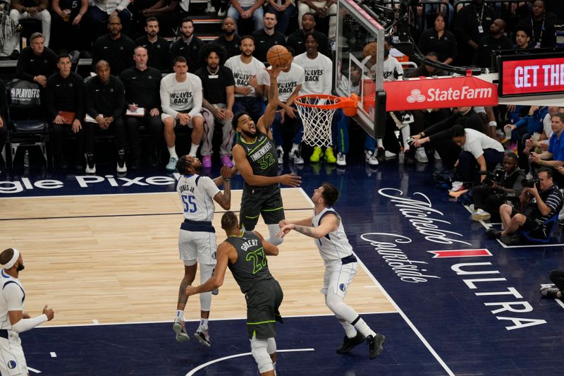 MINNEAPOLIS, MN - MAY 30: Karl-Anthony Towns #32 of the Minnesota Timberwolves drives to the basket during the game against the Dallas Mavericks during Game 5 of the Western Conference Finals of the 2024 NBA Playoffs on May 30, 2024 at Target Center in Minneapolis, Minnesota. NOTE TO USER: User expressly acknowledges and agrees that, by downloading and or using this Photograph, user is consenting to the terms and conditions of the Getty Images License Agreement. Mandatory Copyright Notice: Copyright 2024 NBAE (Photo by Jordan Johnson/NBAE via Getty Images)