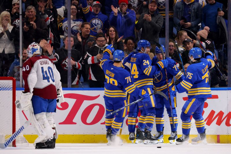 Dec 3, 2024; Buffalo, New York, USA;  Buffalo Sabres right wing JJ Peterka (77) celebrates his goal with teammates during the first period against the Colorado Avalanche at KeyBank Center. Mandatory Credit: Timothy T. Ludwig-Imagn Images